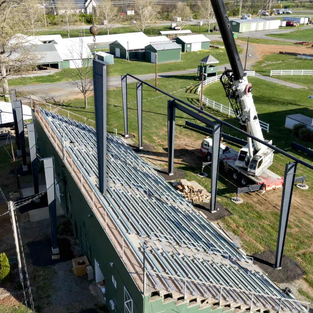 Pine Knoll Construction crew using crane services to complete site work.
