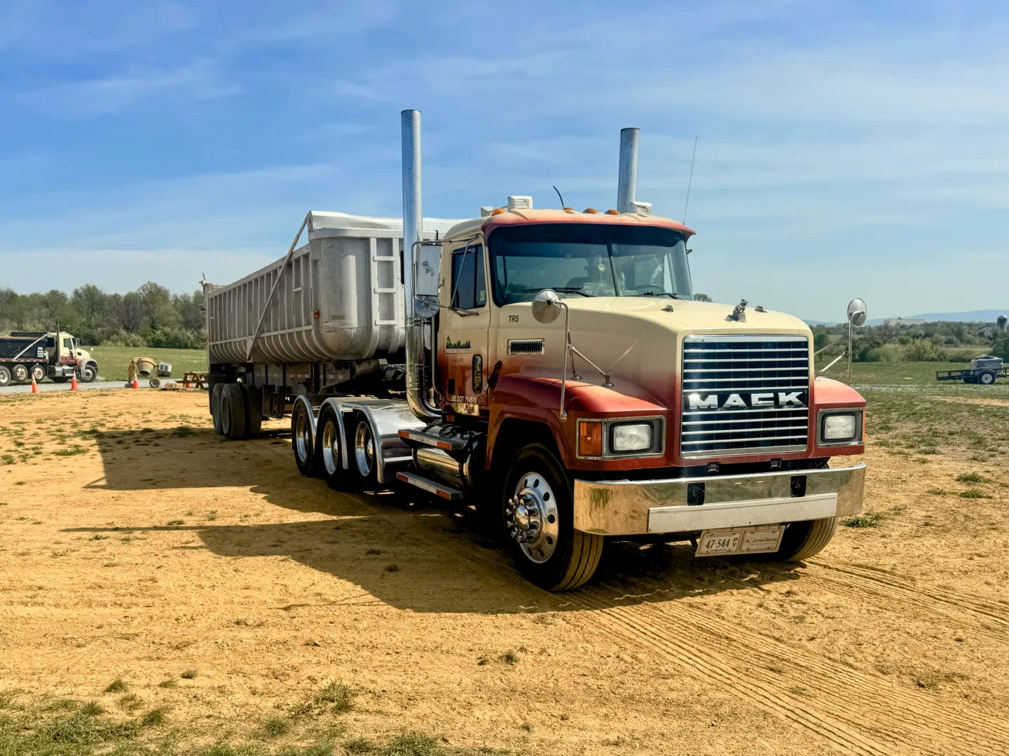 Heavy duty dump trailer hauling screen topsoil to a local project in Winchester VA.